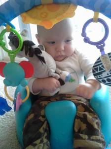 Sitting in his Bumbo and playing with his toys :)